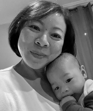Headshot of Sandy Chung with her baby