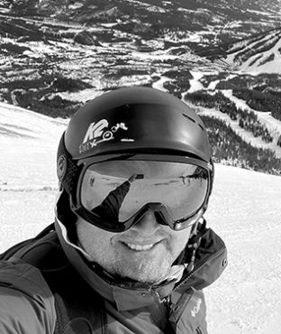 Headshot of Kevin Buchta with snow helmet and goggles